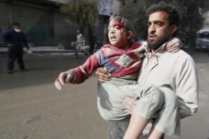 Protesters topple Syrian government statue in Damascus suburb